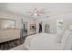 Spacious main bedroom with ensuite bathroom, walk-in closet, and ceiling fan at 639 Elwood St, Deltona, FL 32725