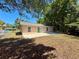 This home features a sunny backyard with a concrete patio, perfect for outdoor entertaining or relaxation at 670 W Tall Pine Ter, Deland, FL 32724