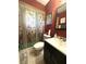 Cozy bathroom featuring decorative shower curtain, modern sink, and a warm, inviting atmosphere at 670 W Tall Pine Ter, Deland, FL 32724