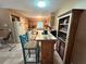 Spacious kitchen with breakfast bar, ample cabinetry, and a dining area for casual meals at 670 W Tall Pine Ter, Deland, FL 32724