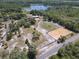 Expansive property featuring a home, equestrian arena, and lush greenery in a serene setting at 685 Enterprise Osteen Rd, Osteen, FL 32764