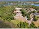 Wide aerial shot showcasing the neighborhood, lakes, landscaping and home with equestrian facilities at 685 Enterprise Osteen Rd, Osteen, FL 32764
