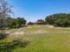 Large backyard with screened-in pool, outbuildings, and ample green space at 685 Enterprise Osteen Rd, Osteen, FL 32764