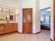 Bright bathroom showcasing a double vanity and direct access to the main bedroom and closet for convenience at 685 Enterprise Osteen Rd, Osteen, FL 32764