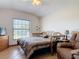 Comfortable bedroom with a daybed, dresser, and a relaxing seating area at 685 Enterprise Osteen Rd, Osteen, FL 32764