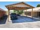 A spacious carport offering ample parking with sturdy wooden beams and a gravel driveway at 685 Enterprise Osteen Rd, Osteen, FL 32764