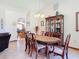 Dining room with a large table, china cabinet, and elegant lighting at 685 Enterprise Osteen Rd, Osteen, FL 32764