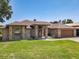 Charming brick home with a well-manicured lawn and attached two-car garage at 685 Enterprise Osteen Rd, Osteen, FL 32764