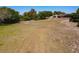Acreage featuring green space and native trees, with home and detached garage in the distance at 685 Enterprise Osteen Rd, Osteen, FL 32764