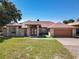 Charming brick home features a well-manicured lawn and a two-car garage at 685 Enterprise Osteen Rd, Osteen, FL 32764