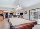 Game room with a pool table and bar area for entertaining guests at 685 Enterprise Osteen Rd, Osteen, FL 32764