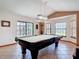 Spacious game room featuring a billiard table with traditional lighting and neutral tones at 685 Enterprise Osteen Rd, Osteen, FL 32764