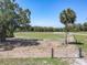 Fenced pasture with lush greenery, mature trees, and a serene rural setting at 685 Enterprise Osteen Rd, Osteen, FL 32764