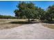 A private drive leading to the home and surrounded by lush greenery, providing a tranquil atmosphere at 685 Enterprise Osteen Rd, Osteen, FL 32764