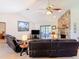 Cozy living room featuring a fireplace, comfortable seating, and sliding door access to the patio at 685 Enterprise Osteen Rd, Osteen, FL 32764