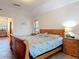 Main bedroom with a seashell themed bedspread with an en-suite bath and access to other rooms at 685 Enterprise Osteen Rd, Osteen, FL 32764