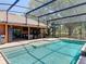A screened in pool features clear water and a partially covered patio space at 685 Enterprise Osteen Rd, Osteen, FL 32764