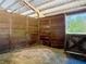 Horse stall in barn, featuring wooden construction and a dutch door at 685 Enterprise Osteen Rd, Osteen, FL 32764
