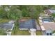 Aerial view of home with a fenced yard, play set, and mature trees at 732 Mockingbird Ln, Deland, FL 32720