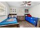 Bright bedroom with decor, laminate flooring, and ceiling fan at 732 Mockingbird Ln, Deland, FL 32720