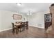 Traditional dining room with a wooden table set and decorative chandelier lighting at 732 Mockingbird Ln, Deland, FL 32720