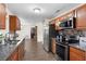 Stylish kitchen with stainless steel appliances, granite countertops, and hardwood flooring at 732 Mockingbird Ln, Deland, FL 32720