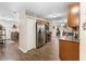 Modern kitchen boasts stainless steel appliances, tile backsplash, and ample cabinet space at 732 Mockingbird Ln, Deland, FL 32720