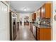 Well-lit kitchen featuring stainless steel appliances, hardwood floors, and granite countertops at 732 Mockingbird Ln, Deland, FL 32720