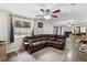 Comfortable living room showcasing a large window, plush seating, decorative rug, and adjacent open workspace at 732 Mockingbird Ln, Deland, FL 32720