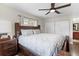 Comfortable main bedroom features a ceiling fan, natural light, and spacious closet at 732 Mockingbird Ln, Deland, FL 32720