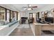 Well-lit office with bay window seating, hardwood floors, and functional built-in workspace at 732 Mockingbird Ln, Deland, FL 32720