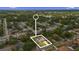 Aerial view of a home with a pool, surrounded by lush greenery and a nearby lake at 795 Superior St, Deltona, FL 32725