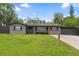 Charming single-story home with a well-manicured lawn and neutral brick facade at 795 Superior St, Deltona, FL 32725