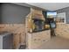 Outdoor brick fireplace with wood storage and mounted television at 795 Superior St, Deltona, FL 32725