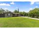 Charming single-story brick home featuring a lush green lawn and a welcoming driveway at 795 Superior St, Deltona, FL 32725