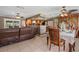 Open concept living area showcasing tile floors, dining area and kitchen at 795 Superior St, Deltona, FL 32725