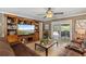 Inviting living room with a large entertainment center and sliding glass doors to the patio at 795 Superior St, Deltona, FL 32725