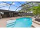 Beautiful pool area with a screened enclosure, outdoor kitchen, and lounge chairs at 795 Superior St, Deltona, FL 32725