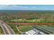 Boundaries outlined in red on a sprawling landscape with ponds and lush green trees at 800 Hidden Oaks Ln, Oak Hill, FL 32759