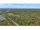 Expansive aerial view of land boundaries surrounded by lush green trees at 800 Hidden Oaks Ln, Oak Hill, FL 32759