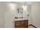 The bathroom features a dark wood vanity and granite countertops at 800 Hidden Oaks Ln, Oak Hill, FL 32759