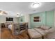 Spacious bedroom with a decorative partition wall, ceiling fans, and hardwood floors at 800 Hidden Oaks Ln, Oak Hill, FL 32759
