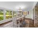 Dining area featuring natural light, with seating for six guests at 800 Hidden Oaks Ln, Oak Hill, FL 32759