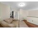 View of hallway with hardwood floors, walk-in closet and light walls, offering a clean and well-lit path at 800 Hidden Oaks Ln, Oak Hill, FL 32759