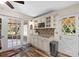 Bright kitchen featuring stainless steel appliances, granite countertops and wine rack at 800 Hidden Oaks Ln, Oak Hill, FL 32759