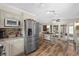 Updated kitchen featuring stainless steel appliances, granite countertops and island at 800 Hidden Oaks Ln, Oak Hill, FL 32759