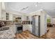 Updated kitchen featuring stainless steel appliances, granite countertops, and natural light at 800 Hidden Oaks Ln, Oak Hill, FL 32759