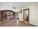The open concept office features wood paneling and plenty of natural light at 800 Hidden Oaks Ln, Oak Hill, FL 32759