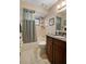Bathroom featuring a shower-tub combo with a gray shower curtain and vanity at 808 Jutland St, Deltona, FL 32725