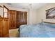 Bedroom featuring neutral carpet, wood accents and a double door closet at 808 Jutland St, Deltona, FL 32725